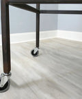 3-Inch Swivel Stem Caster With Non-Marking TPR Rubber Wheel on furniture leg, installed view in room