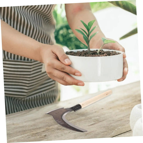 Long Handled Manganese Steel Multi Functional Sickle For Weeding And Harvesting With Ergonomic No Sweat Grip on wooden table