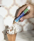 Hand using Beige Tile Grout Pen For Waterproof Grout Paint And Sealer Colorant With Narrow 5mm Tip 7mL on bathroom tile grout