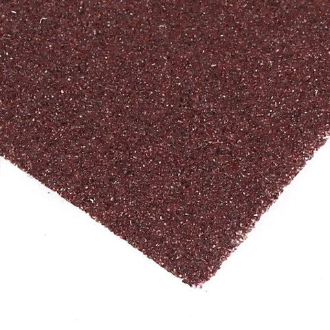 Close-up of Shop Grade Aluminum Oxide Sanding Sheets 100 Grit, showing the brown abrasive texture for wood and metal projects.
