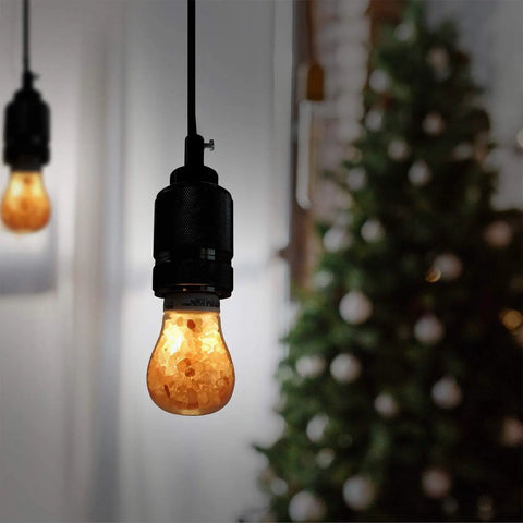 Salt Lamp Inspired LED Bulb With Lit Warm Amber Glow, 60W Equivalent Dimmable A19 Edison Bulb in a cozy room setting