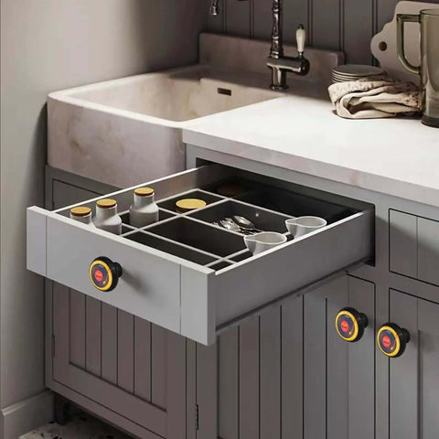Straight Up Game Changing 6 Pack Designer Cabinet Knobs Showcasing Bold Yellow Vinyl Records Woven Into Sleek Black Frames on drawers.