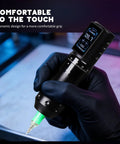 Close-up of a Wireless Tattoo Pen Kit With 2000mAh Cordless Battery in use, showing grip and digital display