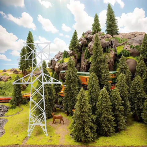 Totally Legit N Scale 1 160 Miniature Electric Transmission Tower in a model railroad diorama with trees and rocks.