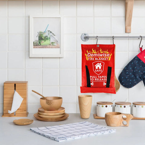 Emergency Fire Blankets For Home Kitchen And Office 4 Pack 40x40 Inches Flame Retardant Safety Blanket Set hanging in the kitchen.