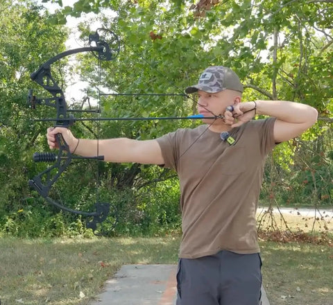 Adult using Dragon X7 Ready To Hunt Compound Bow Kit For Adults - Archery Set With 0-70 Lbs Draw outdoors