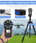 Handheld Anemometer With Digital Wind Speed Gauge And Temperature Readout mounted on tripod with screw hole, hand strap shown