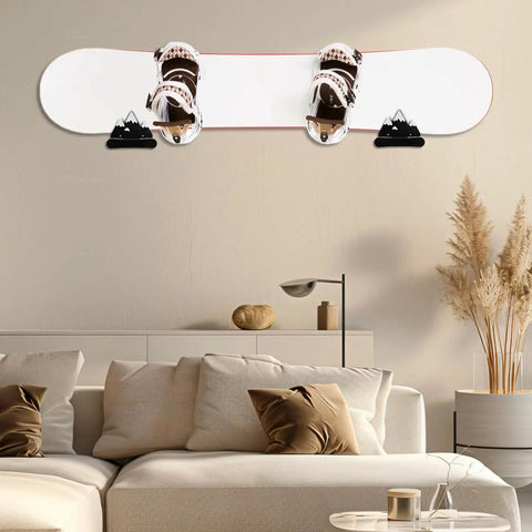 Sturdy Snowboard Wall Mount Racks Hold Four Boards Securely for Garage or Bedroom Displays with Heavy Duty ABS Holders and Skateboard Storage Hooks to Keep Your Shred Game Strong and Clutter Free - snowboard mounted on a wall above a couch.