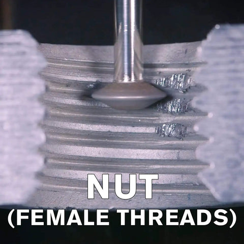 Close-up of Ultimate Rotary Thread Repair Kit Set For Internal And External Threads repairing female nut threads.