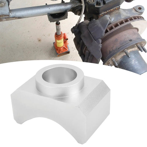 Beefy Billet Aluminum Axle Saddle for Hydraulic Bottle and Floor Jacks, securely lifting a car axle with adapter in use.