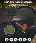Man resting in 4 In 1 Camping Hammock Tent With Mosquito Net showing anti-mosquito design.