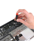 Hand using screwdriver to secure components in laptop with 360Pcs Multisize Laptop And PC Replacement Screw Kit With M2 M2.5 And M3 Hardware For Lenovo Dell HP Sony Asus Acer Toshiba Gateway Samsung And More For SSD M.2 And Case Mounting For Your PC Build.