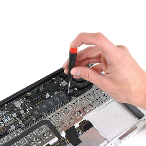 Hand using screwdriver to secure components in laptop with 360Pcs Multisize Laptop And PC Replacement Screw Kit With M2 M2.5 And M3 Hardware For Lenovo Dell HP Sony Asus Acer Toshiba Gateway Samsung And More For SSD M.2 And Case Mounting For Your PC Build.