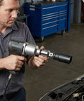 Mechanic using Six Piece Socket Adapter And Reducer Set For One Quarter, Three Eighths, And One Half Inch Drives With Must Have Pro Grade Conversions And Impact Ready Chrome Vanadium Steel Construction on a car engine in a garage.