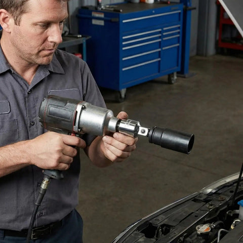Mechanic using Six Piece Socket Adapter And Reducer Set For One Quarter, Three Eighths, And One Half Inch Drives With Must Have Pro Grade Conversions And Impact Ready Chrome Vanadium Steel Construction on a car engine in a garage.
