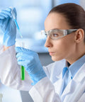 Scientist wearing clear safety glasses in lab, part of 100 Pairs Clear Safety Glasses Bulk For Group Use In Lab And Workshop.