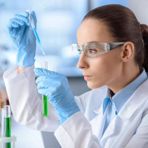 Scientist wearing clear safety glasses in lab, part of 100 Pairs Clear Safety Glasses Bulk For Group Use In Lab And Workshop.