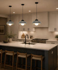 Karjera Black Pendant Lights Kitchen Island, Ribbed Concrete Hanging Light over a modern kitchen island with wooden stools.
