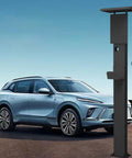 All Weather Rated Outdoor Electric Charger Pedestal Stand beside a silver EV, matte black finish, galvanized steel construction.