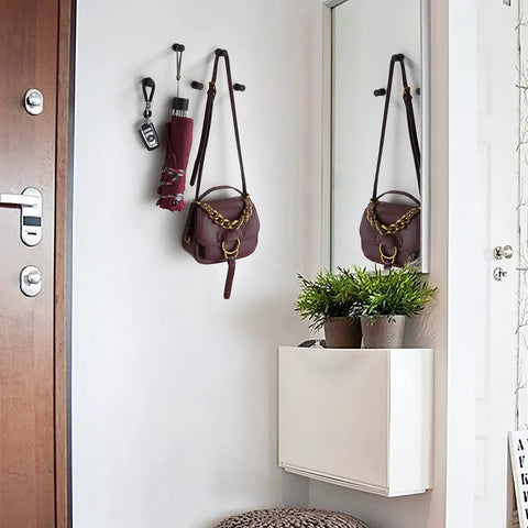 Entrance decor with Compact Brass Robe Hook For Bathroom With Glue, holding keys and purse, modern interior design.