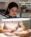 Mega Bright 2200 Lumens LED Desk Lamp with 24W power illuminating nail tech workspace, adjustable arm, black.