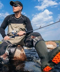 Angler holding Spincast Fishing Reel With All Metal Gears And 3.9 To 1 High Speed Ten Pound Drag Push Button Casting for freshwater fishing.