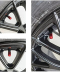 Close-up of red valve stem cap on car wheel, showcasing Four Pack Tire Valve Stem Caps For Cars SUVs Trucks Bikes And Motorcycles Universal Fit Red Protect Valves From Water Dust And Sand With Easy Hand Tightening Durable Exterior Caps That Add Style To Your Wheels