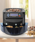 Coin Sorter And Wrapper Machine With LCD Display For US Coins Electronic Coin Counter And Sorter 150 Coins Per Minute Bank Change Sorter Includes Five Coin Bins And Five Tubes Easy Setup And Quiet Operation on table