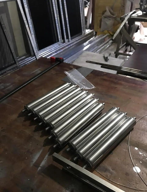 Heavy Duty Stainless Steel Lawn Mower Roller Set 8 Pack With Adjustable 25mm To 60mm Rollers And 700mm Length on a workbench