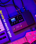 GP 100 Guitar And Bass Amp Modeling Rig With IR Cabinets, 140 Built In Effects, setup alongside keyboard and guitar