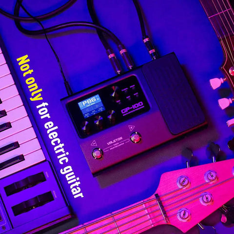 GP 100 Guitar And Bass Amp Modeling Rig With IR Cabinets, 140 Built In Effects, setup alongside keyboard and guitar