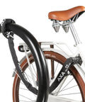 100 cm Plug-In Chain Bike Lock With 5.5 MM Hardened Steel Links securing a bicycle to a black pole for street parking.