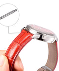 Score A Sweet Six Pack Of Stainless Steel Watch Spring Bar Pins For No Sweat Strap Swaps And Quick Link Removal On Twenty Three Millimeter Bands Every Gearhead Needs To Badge Out Their Timepiece Game. 23mm spring bar pin shown with red leather watch strap.