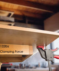 Universal Track Saw Clamp Set With Quick Release securing wooden table with 132 lbs clamping force in workshop setting