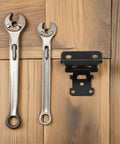 Six Pack Self-Closing Semi-Concealed RV And Cabinet Door Hinges In Cold Rolled Steel beside wrenches on wood surface