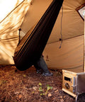 Interior of Hammock Hot Tent With Stove Jack For Winter Camping, showcasing hammock and stove for warmth.