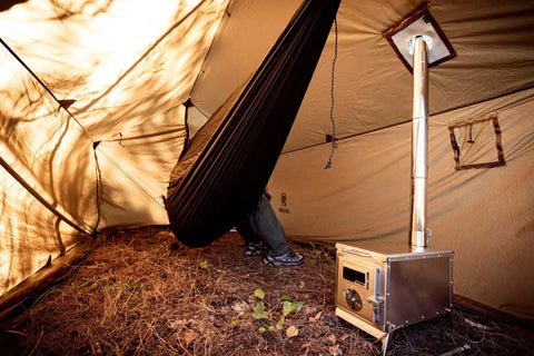 Interior of Hammock Hot Tent With Stove Jack For Winter Camping, showcasing hammock and stove for warmth.