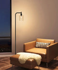 Modern Black Floor Lamp With Seeded Glass Shade Dope Bright LED Bulbs Industrial Tall Pole Standing Lamp For Living Room Bedroom Or Office Sleek Yet Sturdy Lighting That Fits Any Decor next to leather chair in living room