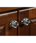 G100 Brand Elegance Glass Collection Clear Glass Knob With Polished Nickel Base on dark wood cabinet doors