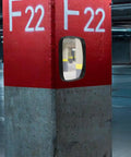 Wide Angle Safety Convex Mirror Rock Solid Wall Mount For Garage Warehouse Parking Lot, installed on a red parking pillar.
