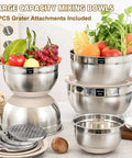 Eight Piece Khaki Stainless Steel Nesting Mixing Bowls With Airtight Lids And Three Grater Attachments For Slicing Grating And Shredding Non Slip Bottoms Great For Mixing And Serving In 5 Qt 4 Qt 3.5 Qt 2 Qt And 1.5 Qt shown with vegetables and grater plates.