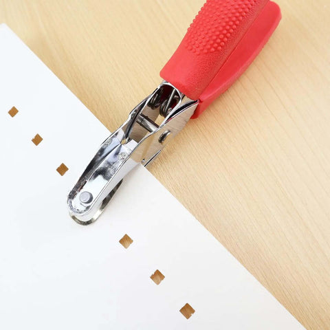 Square Hole Paper Punch 3 Sixteenth Inch Handheld Puncher with Red Soft Grip Handle in use on paper, creating square holes