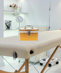 Built Tough Aluminum Tool Box With Secure Lock And Heavy Duty Handle For Mechanics And Field Pros Compact Organizer Gear Hauler on a massage table.