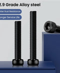 120 Piece Rock Solid M3 X 12MM Hex Socket Head Cap Screws Bolt Set In 12.9 Grade Alloy Steel With Black Oxide Finish And Included Hex Wrench For Tough Jobs And Weekend Warrior Builds, showing black oxide screws on a blue surface.