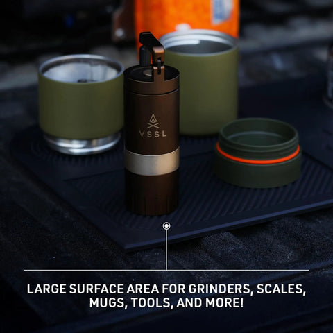Rock Solid Silicone Tailgate Mat For Outdoor Coffee Brewing And Camper Kitchen Setup Non Slip Heat Resistant Food Grade Pour Over Station with grinders and mugs on a tailgate