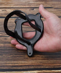 Hand holding black Heavy Duty Horse Bridle Rack With Bracket Hooks for Tack Room Organization Metal Halter Hanger