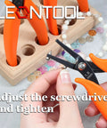 Using 6 Inch Metal Hole Punch Pliers for 1.5mm clean holes in jewelry making, shown with orange PVC grips, close-up view.