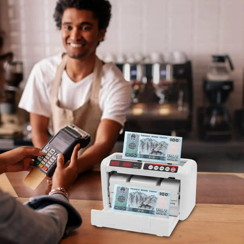 Portable Digital Money Counter With UV And MG Detection, 800 Bills Per Minute in use at a cafe counter, person holding card reader.
