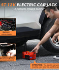 Side view of a red 12V electric car jack under a car; portable hydraulic floor jack with LED light