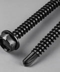 Top Grade 10 Gauge X 3/4 Inch Self Drilling Screws, 58 Pack Black Zinc Hex Washer Head Sheet Metal Fasteners, Durable 410 Stainless Steel With Drive Bit For Tough Building Jobs That Get Done Easy Without Hassle close-up showing screw head and tip.